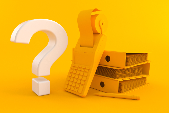 simbolo de interrogación y una calculadora sobre leyes